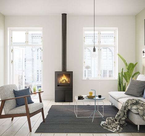 Q-TEE 2 GAZ avec porte en acier Poêle à gaz Q-TEE 2 avec porte en acier et socle pratique dans un appartement stylé au cœur de la ville