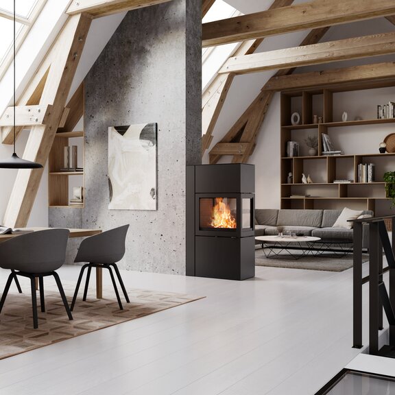 Stove 600 RD in black acts as a room divider between the dining room and modern living room