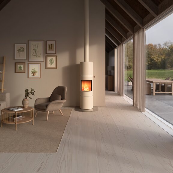 VIVA 160 L wood stove in sand colour with steel door and oak nature handle in a bright living room