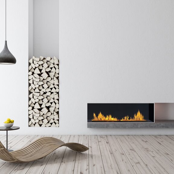 Feu d'effet électrique Cassette 1000 encastré dans le mur blanc du salon avec parquet